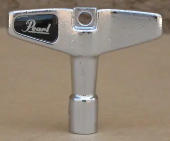 Drum key Pearl K050 with unusual yellow color logo