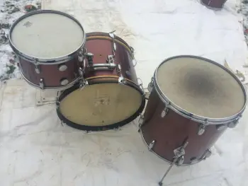 are Vintage Gretsch Round Badge 3 pc drum set in original burgundy sparkle wrap finis